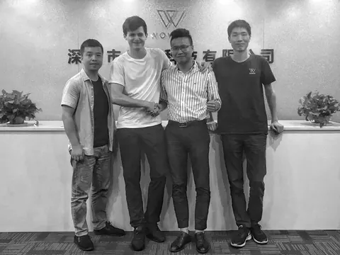 Bennett Harris shaking hands with the WOWGO team in Shenzhen, 2019