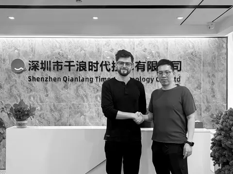 Bennett Harris shaking hands at Shenzhen Qianlang Time Technology, August 2026